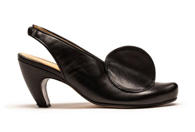 Black high heel shoe with slingback and disc detail