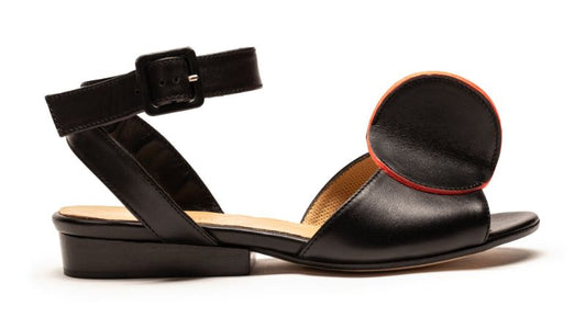 Beautiful hand crafted sculptural sandals in black and neon red luxury italian calf leather by designer Tracey Neuls