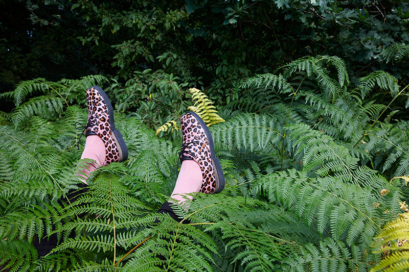 Leopard print pink shoes in foliage