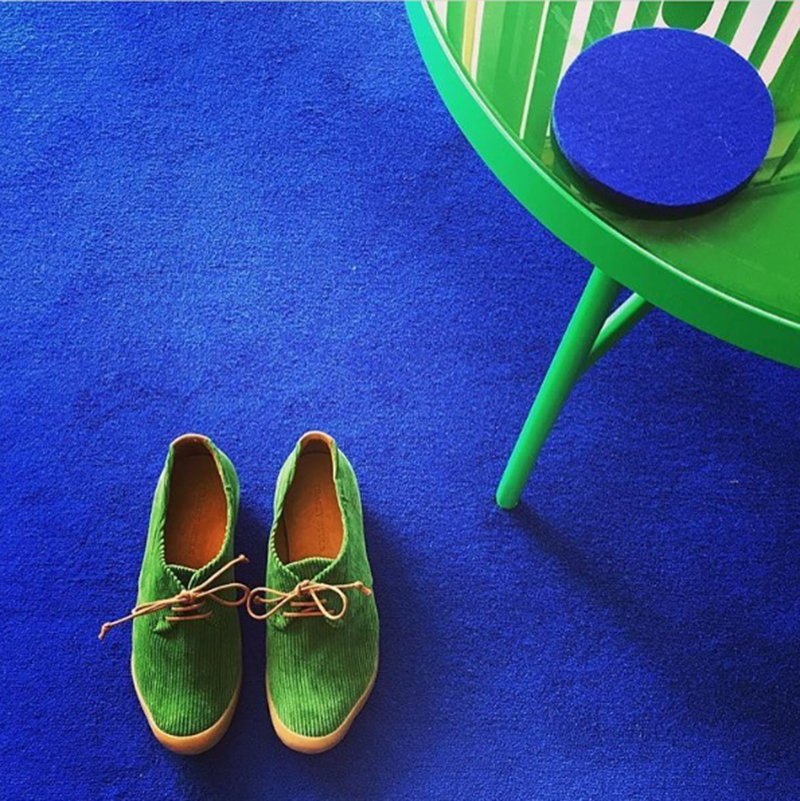green shoes and table and blue carpet