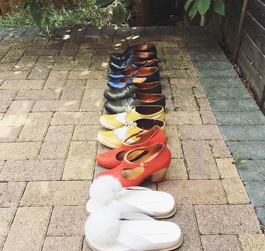 pairs of Tracey Neuls shoes all in a row on patio