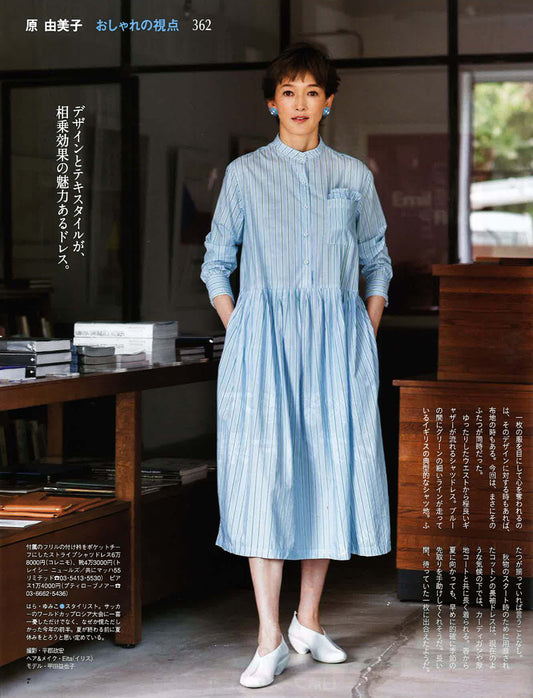 Japanese woman wearing long pale blue dress and white slip on shoes by Tracey Neuls