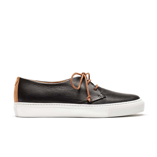 a black mens leather sneaker made by hand from artisans in Portugal. Designed by Tracey Neuls