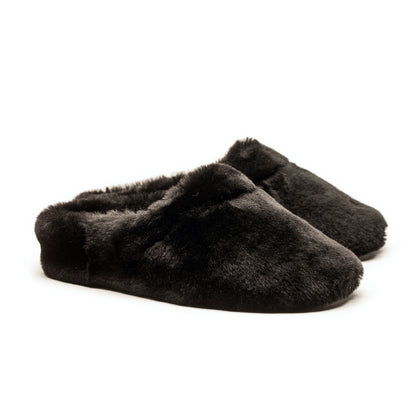 Black shearling slippers designed by Tracey Neuls